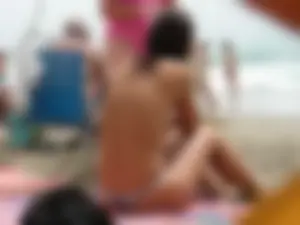 Hot topless girl on the beach in a thong bikini with a nice ass