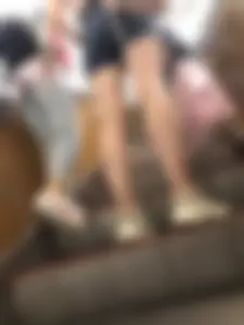 Candid Girl in Denim Shorts and Sneakers Standing on the Escalator - Hot Legs Closeups