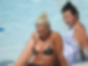 Classy blonde bikini milf lounging at the pool with her sister [088]