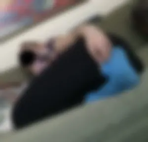 Candid Girl in Blue Socks Lying on the Couch Home Photo