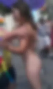 Nude small boobed girl at Toronto pride parade with a couple bonus girls