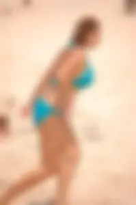 Assortment of sexy babes at the beach in bikinis
