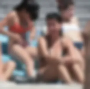 Bunch of sexy babes at the beach in bikinis