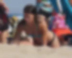 2 cute friends in bikinis on the beach
