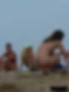 Sexy babe with a nice body topless and in a thong on the beach