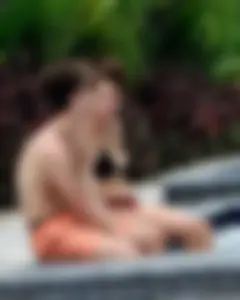 Jacuzzi girl with a nice ass in semi thong bikini and some cleavage