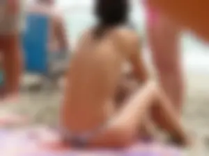 Hot topless girl on the beach in a thong bikini with a nice ass