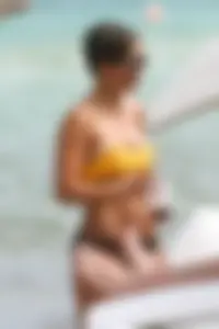 Frankie Bridge nip slips in a bikini on the beach