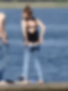 Girl on the water in black thong bikini with a nice ass