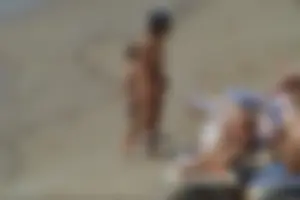 Girls on a nude beach in Sitges, Spain