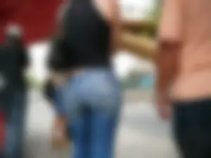 Red haired lady with a nice ass in tight jeans waiting for the bus