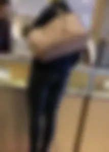 Brunette jewelry shopping in leggings with a nice ass