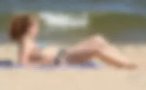 Two sexy beach teens in bikinis, one thick and one skinny with big boobs