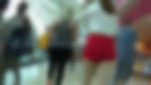 Red short shorts teen cheeks out. walking in mall