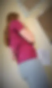 College student in grey leggings almost with camel toe showing