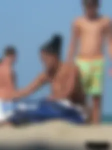 Hot ass topless beach girl with great tits lets her little brother oil up her ass in thong bikini