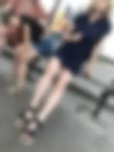 Very cute teen candid girl in a dress sitting on a bus stop creepshots