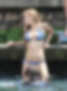 Sexy girl at the pool in a bikini with great tits
