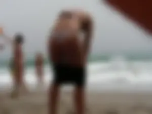 Hot topless girl on the beach in a thong bikini with a nice ass