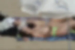 Girls on a nude beach in Sitges, Spain