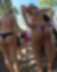 Two nice asses in thong bikinis at a Disney waterpark