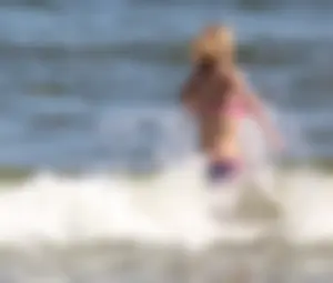 Two sexy beach teens in bikinis, one thick and one skinny with big boobs