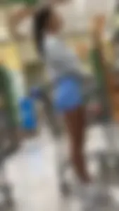 Latina Lady Lumps in blue spandex shorts