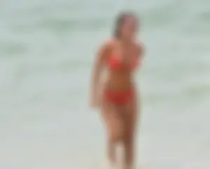 Two sexy ass girls on the beach in bikinis