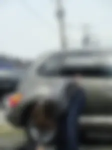Girl cleaning her car in jeans and showing some cheetah print underwear
