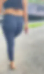 Latina chick with nice wedgie in black tights walking park trail