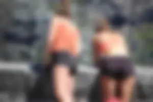 Tourist friends backpacking in shorts with vpl