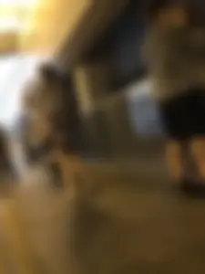 Cute Teen in Shorts on the Tram Stop