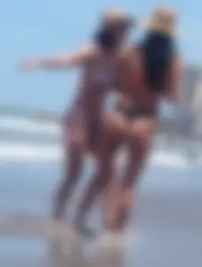 2 milfs in thong bikinis on the beach