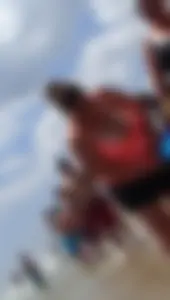 Thick lady on the beach with huge tits