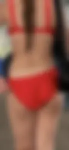 Beauty picks at her bikini wedgie