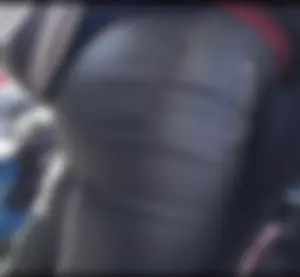 Milf shows off her shapely ass in her leather pants at the market