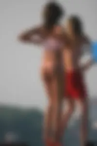 A bunch of sexy beach voyeur babes in bikinis, thongs and topless