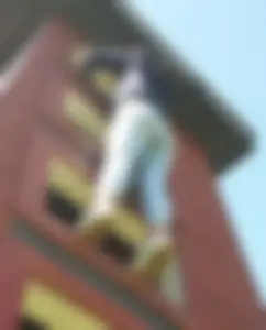 Hot Girl in Tight Jeans Climbing a Building - Creepshot from Below
