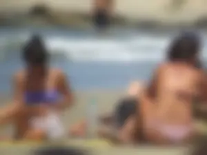 Girl with a great ass in thong bikini on the beach