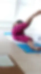 Sexy girlfriend doing yoga at home in leggings