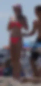 Sexy and skinny girl on the beach in pink bikini
