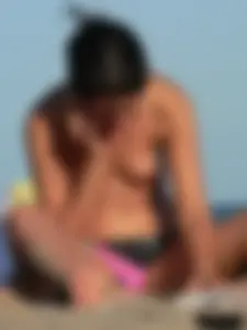 Sexy girls going topless at the beach showing off their sexy bodies