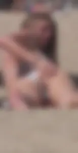 Girl in a Swimsuit Lying on the Beach And Grabbing Her Ass, Spreading Her Butt Cheeks