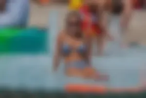 Sexy blonde babe at the pool with nice tits