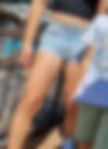 Absolutely amazing creepshots of a young girl wearing a crop top and fringed denim shorts