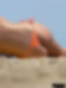 Two topless friends on the beach with nice boobs