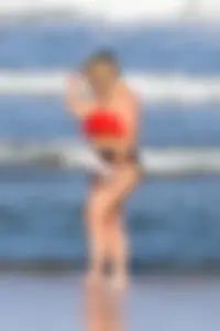 Thick BBW blonde lady in a bikini at the beach