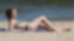 Two sexy beach teens in bikinis, one thick and one skinny with big boobs