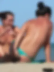 Bunch of sexy babes on the beach topless and in thong bikinis