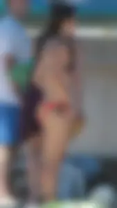 Bunch of sexy babes at the beach in bikinis